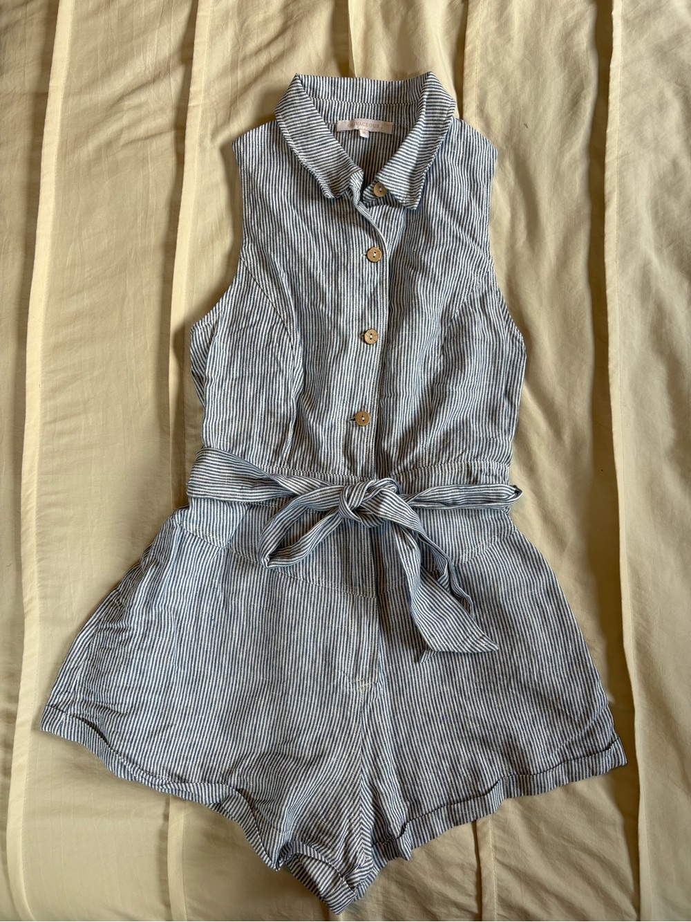 These Three Boutique Sleeveless Striped Tie-Waist Linen Romper in Blue and White